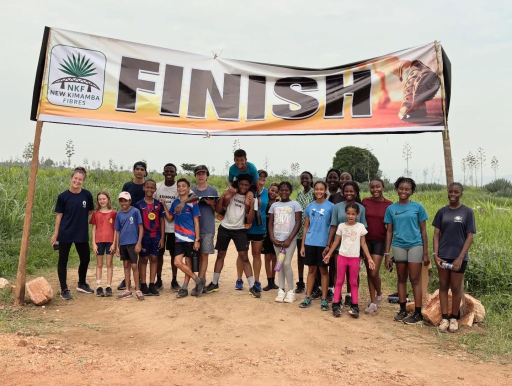 MIS Cross Country Team celebrate a weekend outdoors, at the finish line