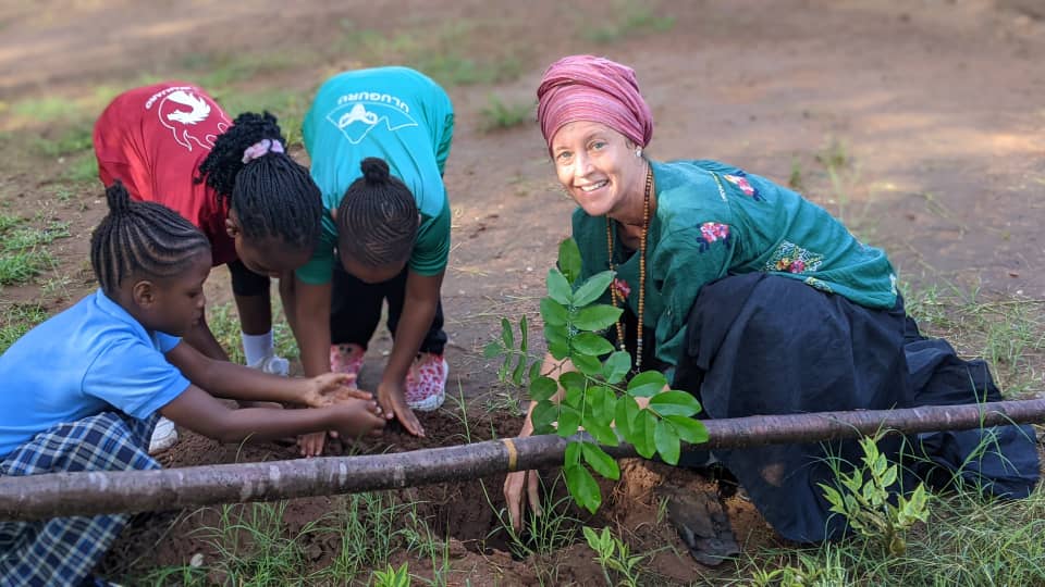 MIS Ms KC and kids planting a tree in Earth Day